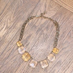 Gold color necklace with clear and yellow stones